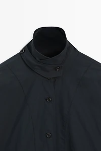 Jacket with buttoned collar strap