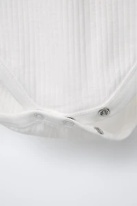 THREE-PACK OF SHORT SLEEVE BODYSUITS