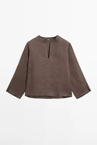 100% linen blouse with topstitching detail