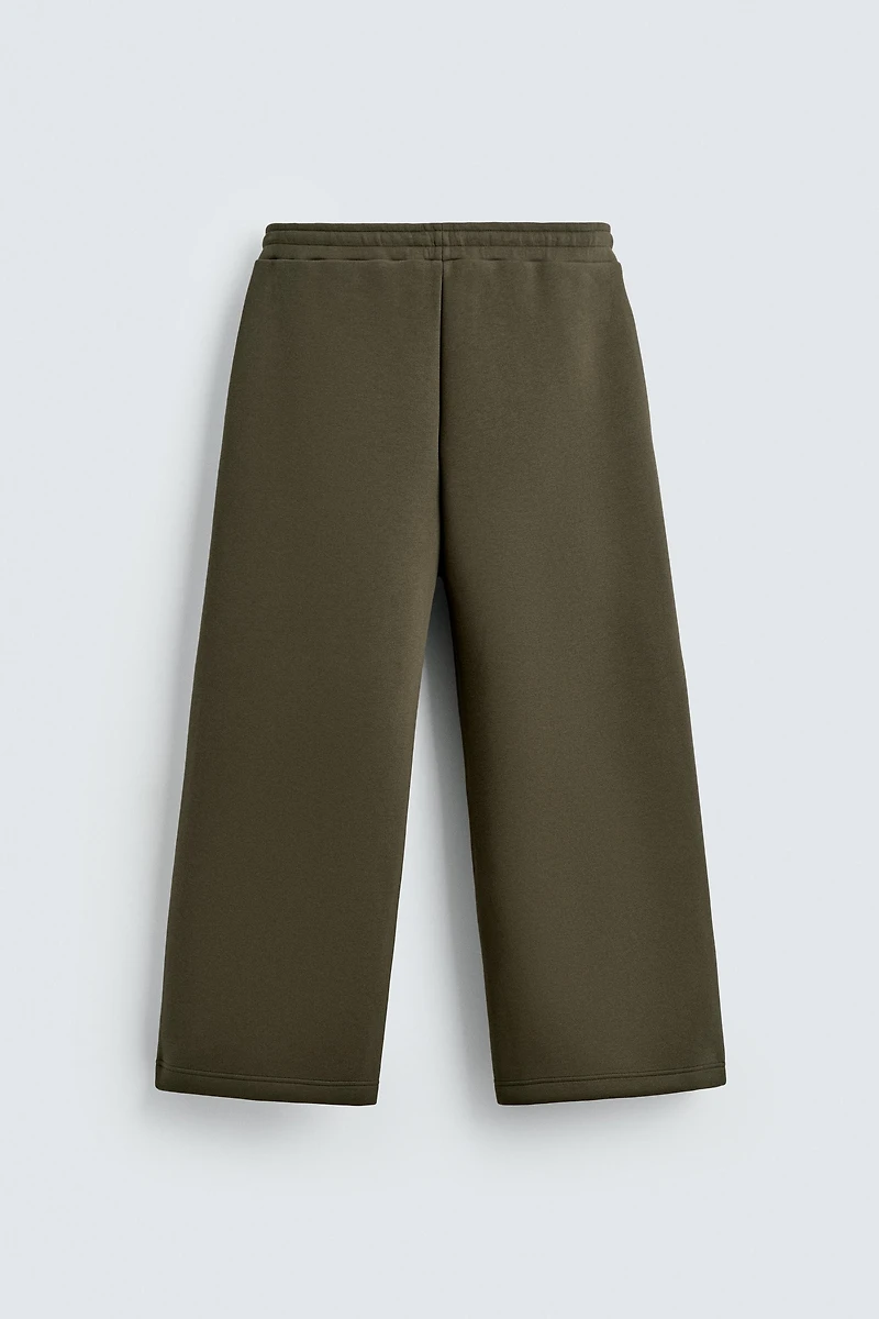 WIDE FIT NEOPRENE EFFECT PANTS WITH STUDS