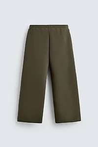 WIDE FIT NEOPRENE EFFECT PANTS WITH STUDS