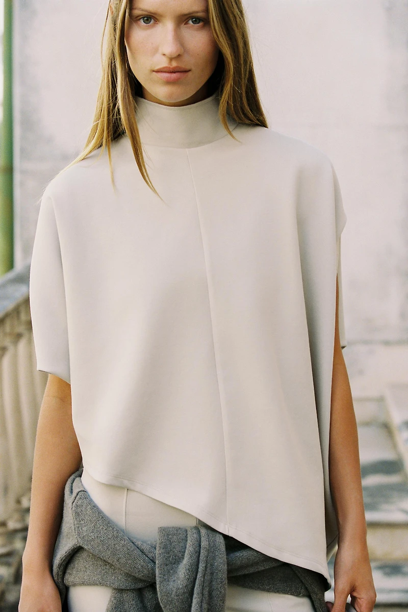 ASYMMETRIC INTERLOCK CAPE