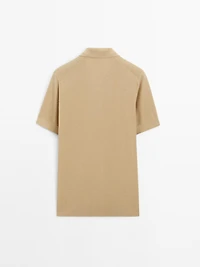 Textured knit short sleeve polo shirt