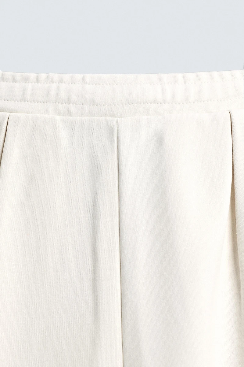 PLEATED WIDE FIT JOGGER PANTS