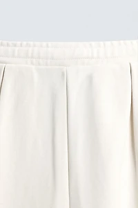 PLEATED WIDE FIT JOGGER PANTS