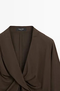 Flowing blouse with draped detail