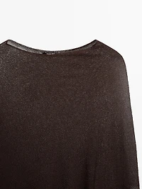 Cape en maille coupe asymétrique