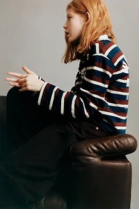 STRIPED STRANGER THINGS © NETFLIX POLO SHIRT