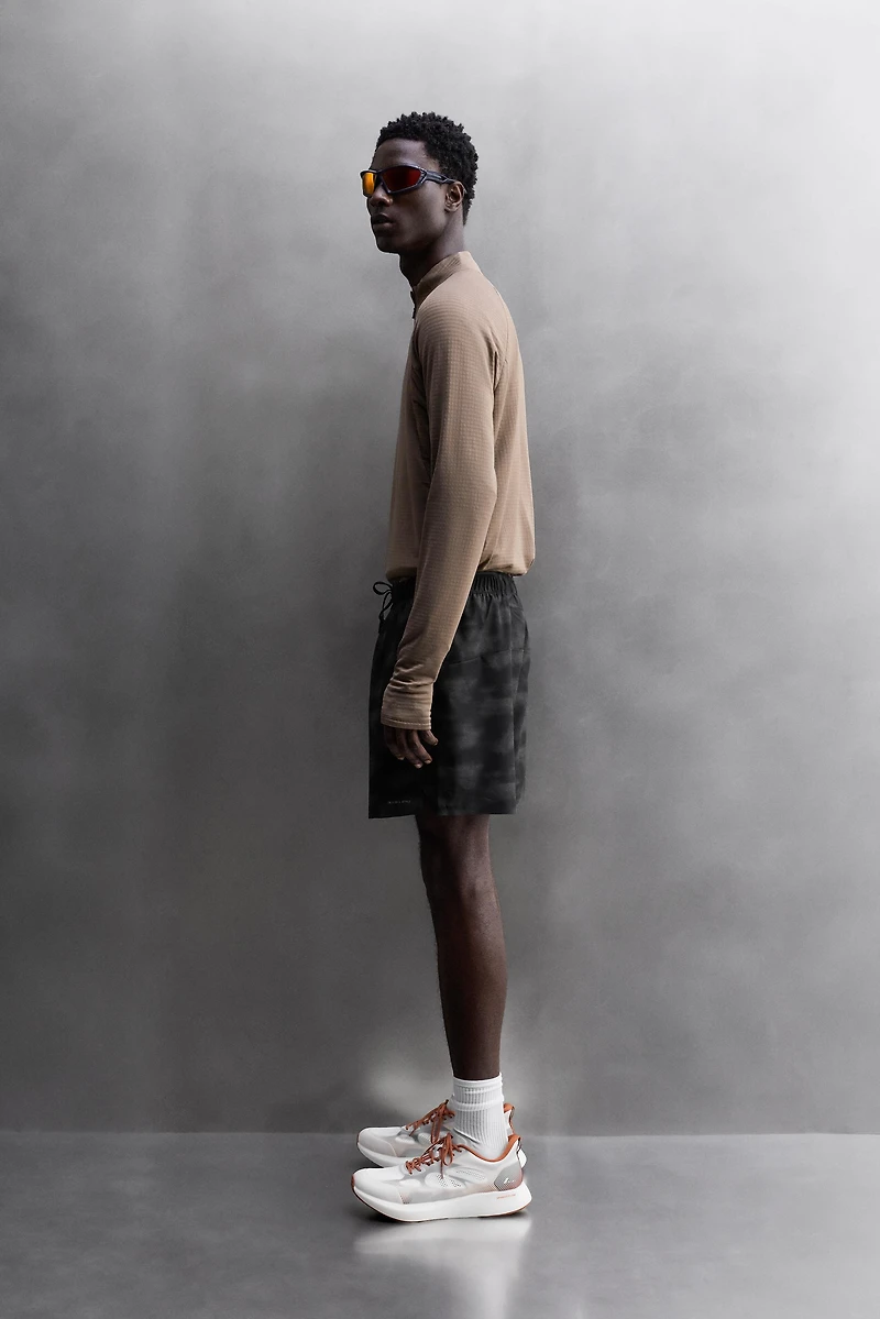 PERFORATED RUNNING SHORTS