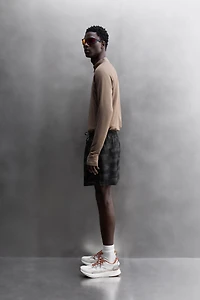 PERFORATED RUNNING SHORTS