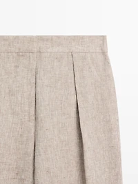 Suit trousers with buckle detail