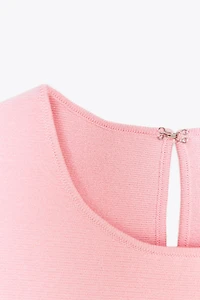 TIE-DETAIL PEPLUM KNIT TOP