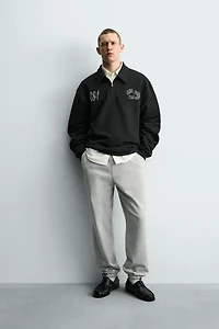 SWEAT COL ZIPPÉ INSCRIPTIONS