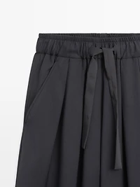 Pantalon large volume à plis