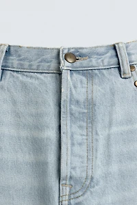 JEAN STRAIGHT FIT CLOUS MÉTALLIQUES