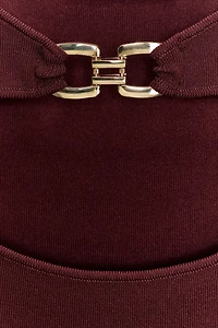 CUT OUT KNIT DRESS WITH METAL DETAIL