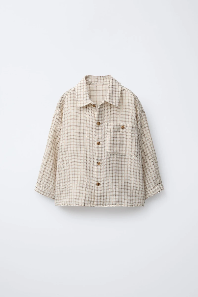 CHEMISE À CARREAUX ET POCHE
