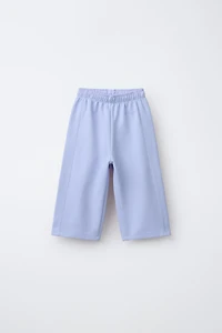 WIDE LEG INTERLOCK RAISED TEXT PANTS