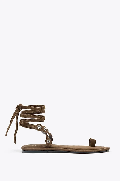 LEATHER SANDALS WITH METAL EYELETS