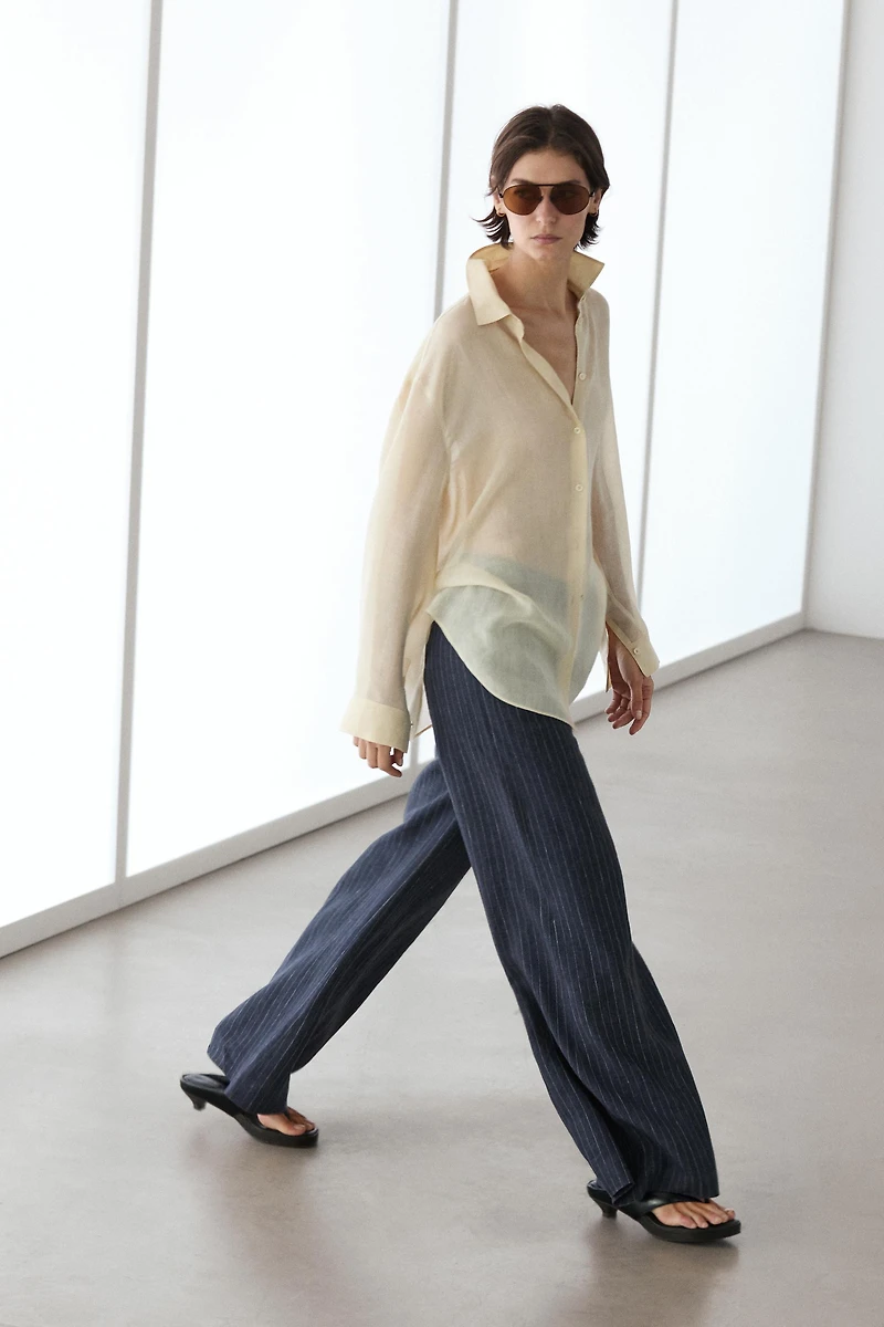 Flare fit linen trousers with striped details