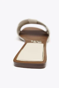 FLAT CROSSED LEATHER SANDALS
