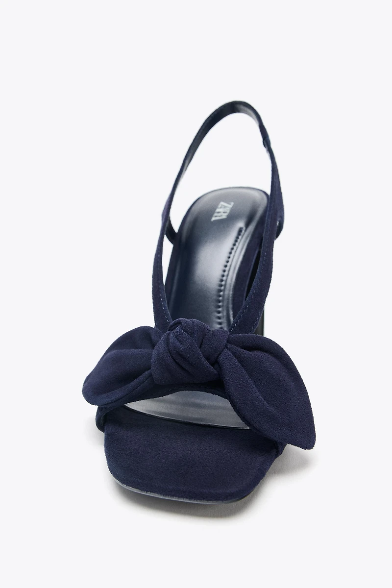 SUEDE BOW HEELED SANDALS