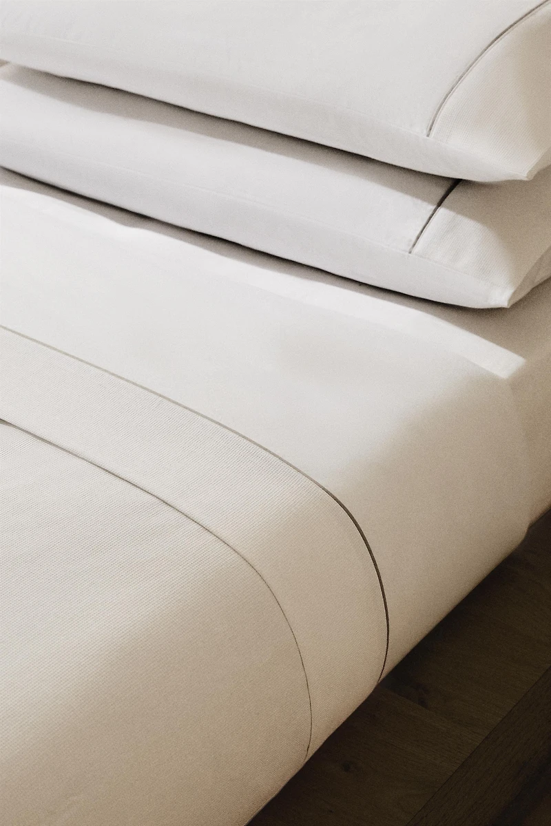 DRAP DE DESSUS PIQUÉ PASSEPOIL