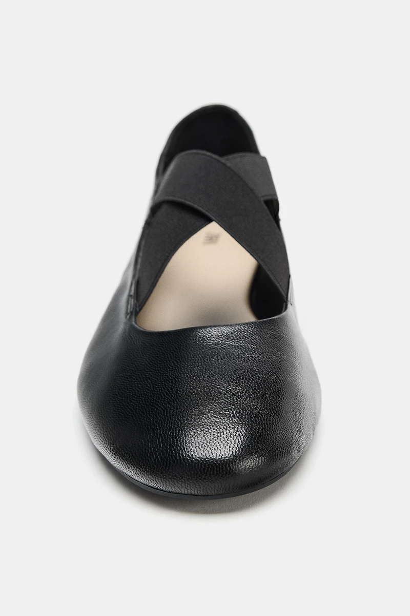 LEATHER BALLET FLATS WITH CROSSED ELASTIC STRAPS