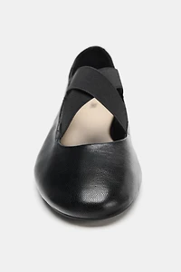 LEATHER BALLET FLATS WITH CROSSED ELASTIC STRAPS