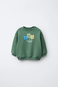 CLOVER PRINT AND EMBROIDERED TEXT SWEATSHIRT