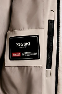 SHORT FAUX FUR HOODIE RECCO® TECHNOLOGY SKI COLLECTION