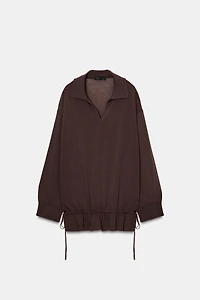 PULL EN MAILLE À PLIS