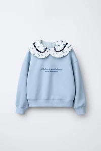 SWEATSHIRT WITH RUFFLED NECK AND EMBROIDERED TEXT