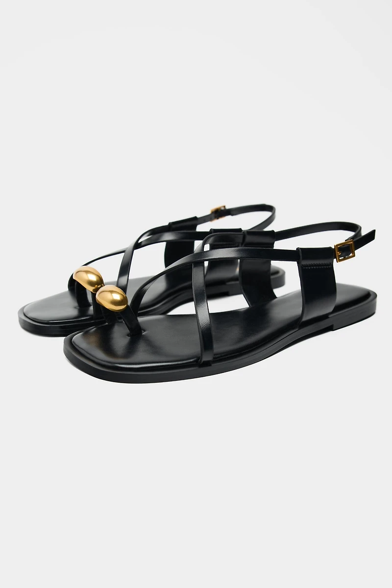 FLAT SANDALS WITH METALLIC DETAIL