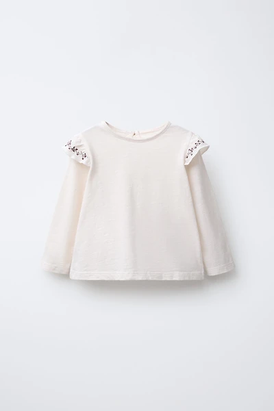 HAUT À VOLANT FLEURS BRODÉES