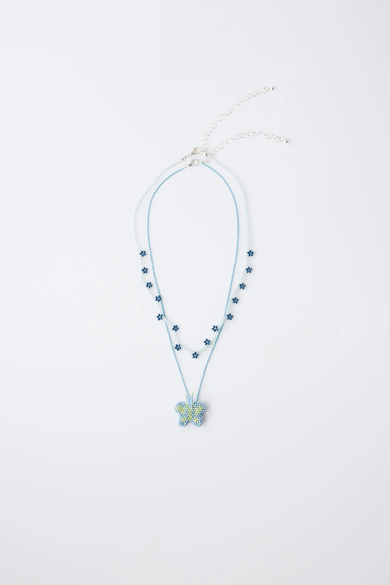 PACK OF TWO BUTTERFLY AND FLOWER BEADED NECKLACES
