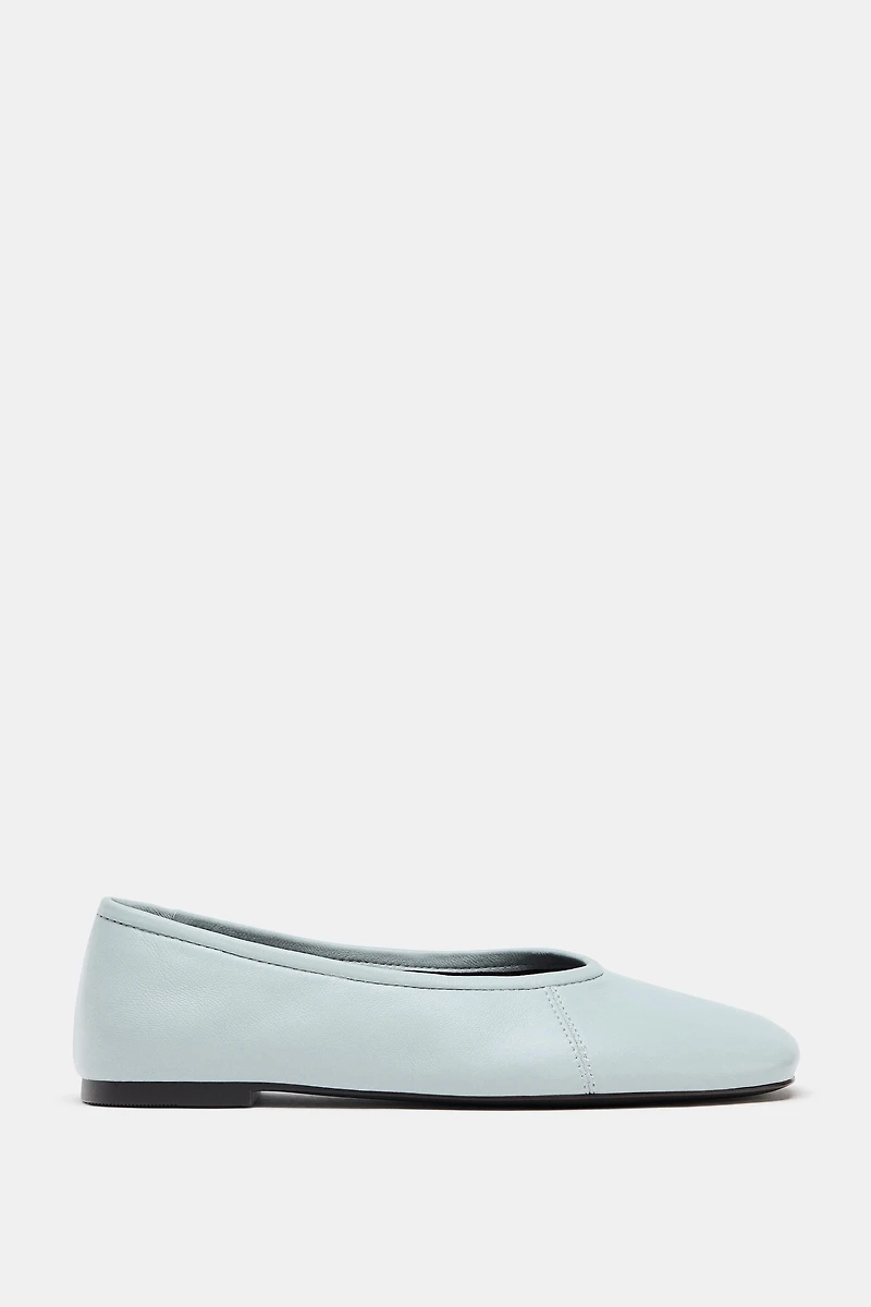 BALLERINES EN CUIR AVEC SURPIQÛRES