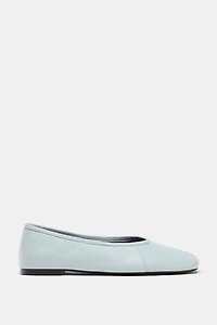 BALLERINES EN CUIR AVEC SURPIQÛRES