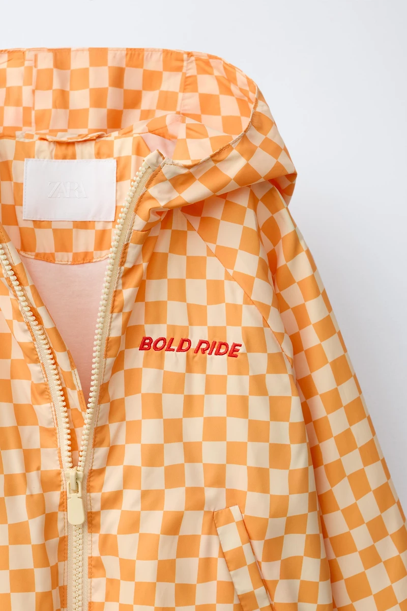LIGHTWEIGHT CHECKERBOARD RAINCOAT