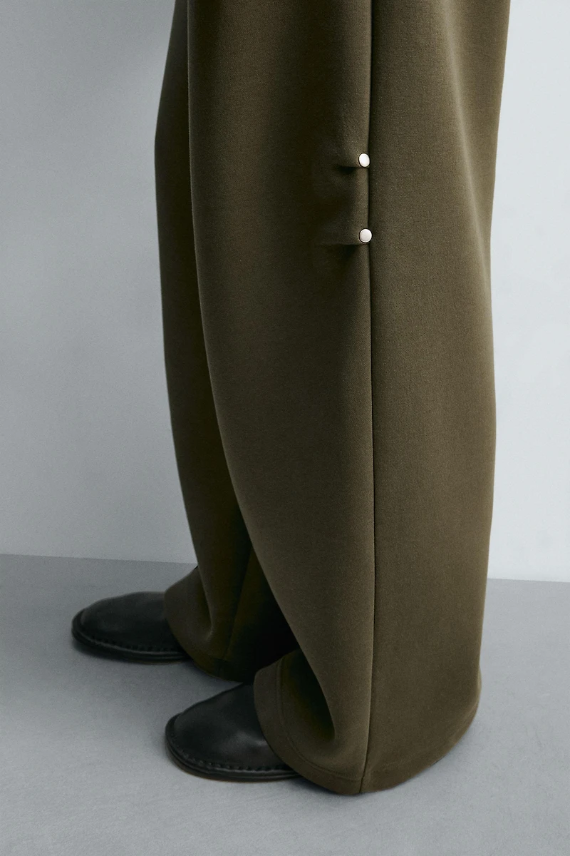 WIDE FIT NEOPRENE EFFECT PANTS WITH STUDS