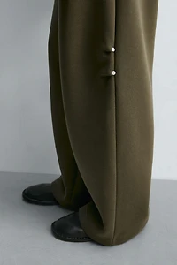 WIDE FIT NEOPRENE EFFECT PANTS WITH STUDS
