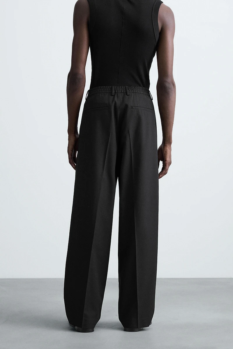 FLOWY PLEATED WIDE FIT PANTS
