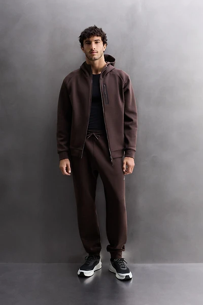 SWEAT TECHNIQUE ZIPPÉ À CAPUCHE