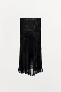 JUPE MI-LONGUE À VOLANTS ET FANTAISIE