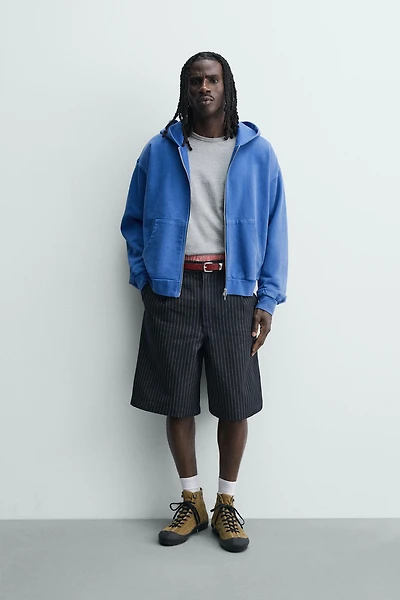 PINSTRIPED PLEATED SHORTS