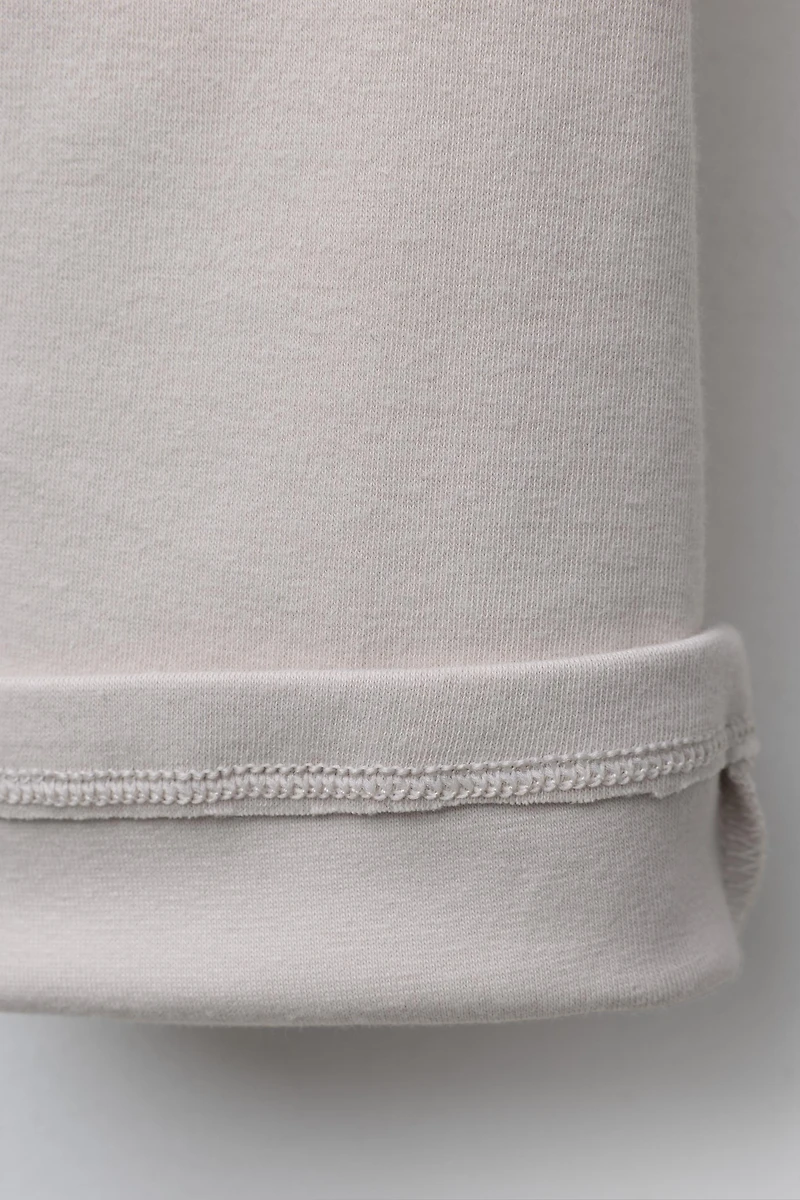 PLUSH FLARE PANTS WITH RAISED TEXT