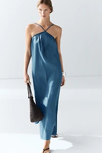 Long flowing dress with criss-cross straps