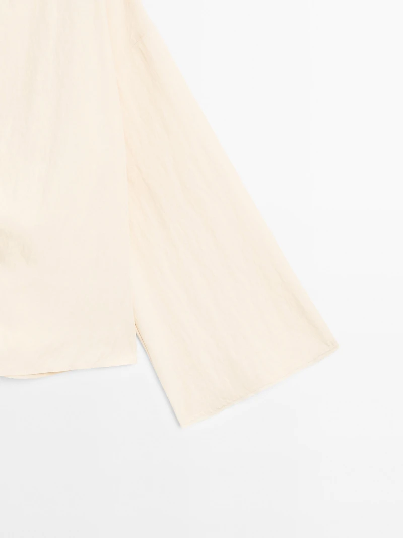 Long sleeve blouse with side button fastening