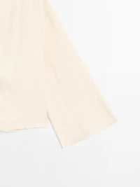 Long sleeve blouse with side button fastening