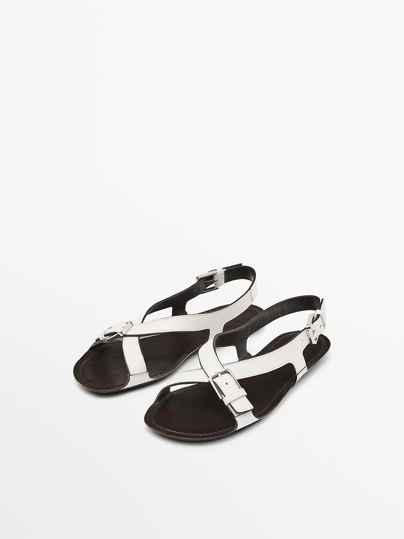 Flat leather sandals with buckles